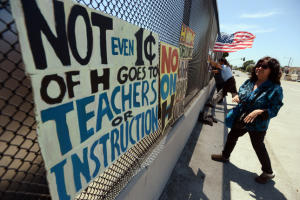 Linda Ruiz-Lozito, of Richmond, joins fellow 'No on H' demonstrators on the McBryde Ave. overpass  to show their opposition to the bond measure